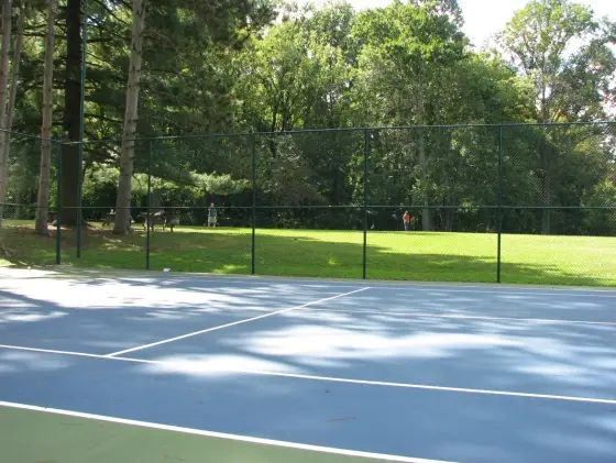 The tennis court and lawn at camp